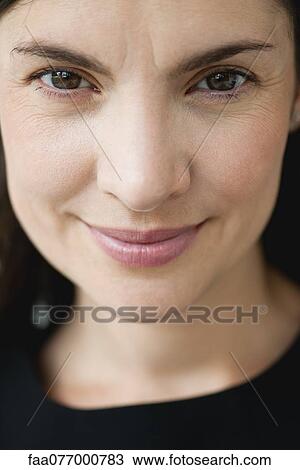 Stock Image - Smiling mid-adult woman. Fotosearch