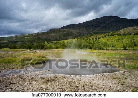 Stock Image - Steam rising from volcanic hot spring, Iceland. Fotosearch
