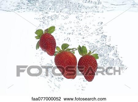 Strawberries submerged in water View Large Photo Image Stock Image - Strawberries submerged in water. Fotosearch