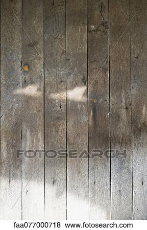 Stock Photo - Sunlight on wooden wall. Fotosearch