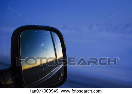 Sunset reflected in car side-view mirror View Large Photo Image Stock Photo - Sunset reflected in car side-view mirror. Fotosearch
