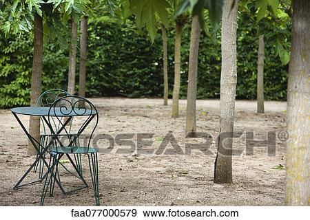 Table and chairs in park View Large Photo Image Stock Photo - Table and chairs in park. Fotosearch