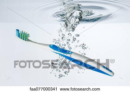 Toothbrush submerged in water View Large Photo Image Stock Image - Toothbrush submerged in water. Fotosearch