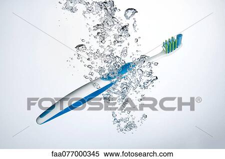 Stock Photography - Toothbrush submerged in water. Fotosearch