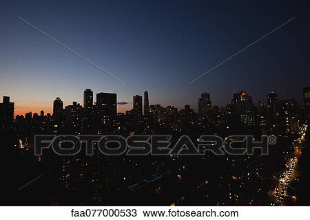 Stock Image - USA, New York, New York City at night. Fotosearch