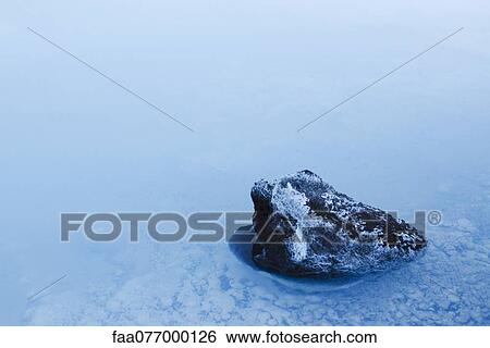Stock Photograph - Volcanic rock covered in silica mineral deposits, Blue Lagoon, Reykjanes Peninsula, Iceland. Fotosearch