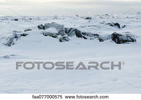 Stock Photography - Volcanic rock covered in snow, Reykjanes Peninsula, Iceland. Fotosearch
