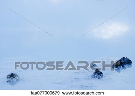 Stock Photo - Volcanic rocks in Blue Lagoon, Reykjanes Peninsula, Iceland. Fotosearch