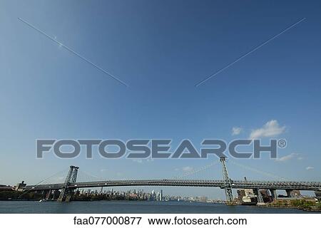 Williamsburg Bridge and East River, New York City, New York, USA View Large Photo Image Stock Photo - Williamsburg Bridge and East River, New York City, New York, USA. Fotosearch