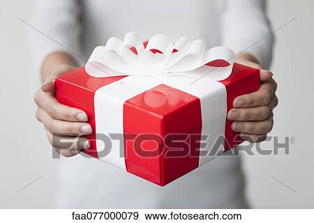 Woman holding gift box, cropped View Large Photo Image Stock Photo - Woman holding gift box, cropped. Fotosearch