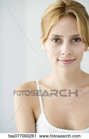 Young woman in camisole, portrait View Large Photo Image Stock Image - Young woman in camisole, portrait. Fotosearch