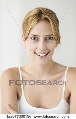 Young woman in camisole, portrait View Large Photo Image Stock Photograph - Young woman in camisole, portrait. Fotosearch