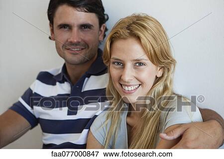 Young woman with boyfriend, portrait View Large Photo Image Stock Photo - Young woman with boyfriend, portrait. Fotosearch