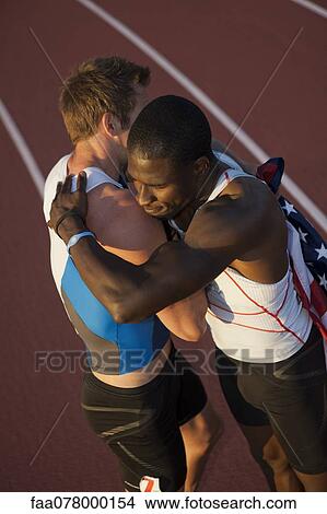 American running teammates embracing after race View Large Photo Image Picture - American running teammates embracing after race. Fotosearch