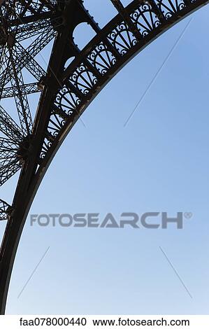 Stock Image - Arch of Eiffel Tower, Paris, France. Fotosearch