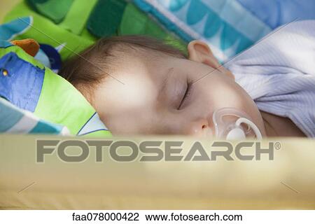 Stock Image - Baby girl sleeping. Fotosearch