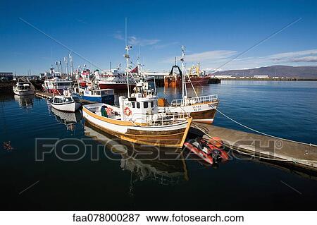Boats docked in marina View Large Photo Image Stock Photo - Boats docked in marina. Fotosearch