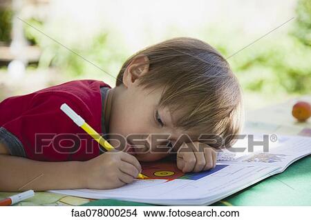 Boy coloring with markers View Large Photo Image Picture - Boy coloring with markers. Fotosearch