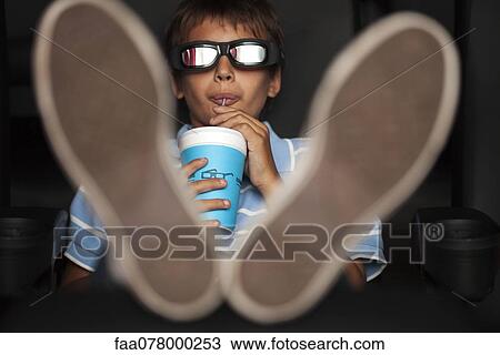 Boy enjoying 3-D movie in theater View Large Photo Image Stock Image - Boy enjoying 3-D movie in theater. Fotosearch