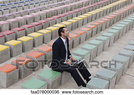 Business executive using laptop computer outdoors View Large Photo Image Stock Photograph - Business executive using laptop computer outdoors. Fotosearch