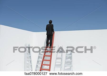 Businessman climbing ladder, rear view View Large Photo Image Stock Photo - Businessman climbing ladder, rear view. Fotosearch