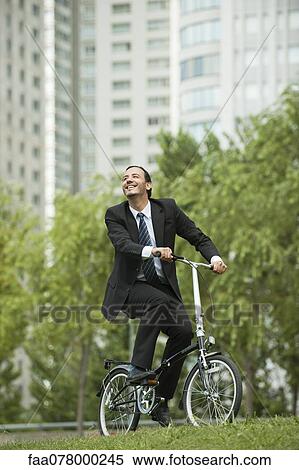 Businessman riding bicycle View Large Photo Image Stock Photography - Businessman riding bicycle. Fotosearch