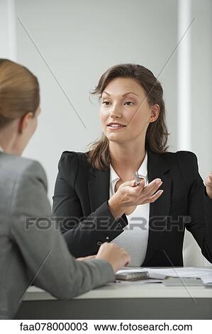 Businesswoman advising client View Large Photo Image Stock Image - Businesswoman advising client. Fotosearch