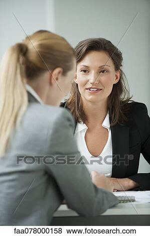 Businesswoman interviewing job applicant View Large Photo Image Stock Photo - Businesswoman interviewing job applicant. Fotosearch