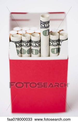 Cigarette pack containing rolled dollars View Large Photo Image Stock Image - Cigarette pack containing rolled dollars. Fotosearch