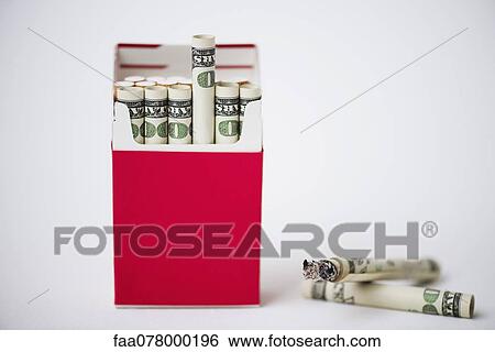 Cigarette pack containing rolled dollars View Large Photo Image Stock Photograph - Cigarette pack containing rolled dollars. Fotosearch
