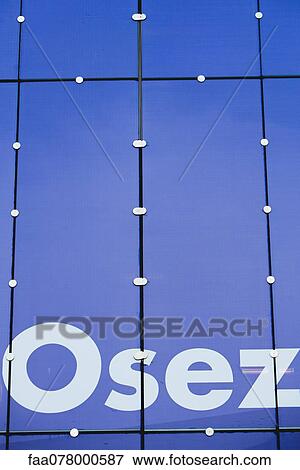 Stock Photo - Close-up of "osez" painted on building facade. Fotosearch