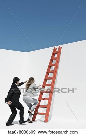 Executives racing each other to climb ladder View Large Photo Image Stock Photo - Executives racing each other to climb ladder. Fotosearch