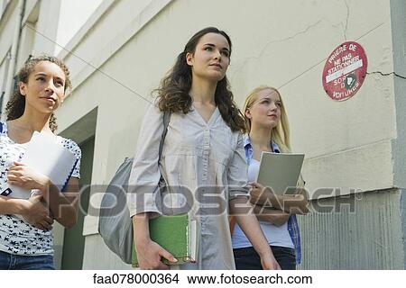 Picture - Female college students walking outdoors. Fotosearch