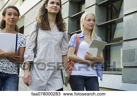 Stock Image - Female college students walking outdoors. Fotosearch