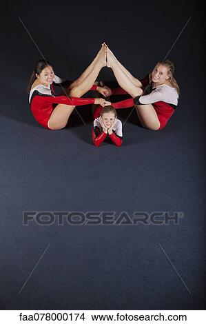 Female gymnasts performing floor routine View Large Photo Image Picture - Female gymnasts performing floor routine. Fotosearch