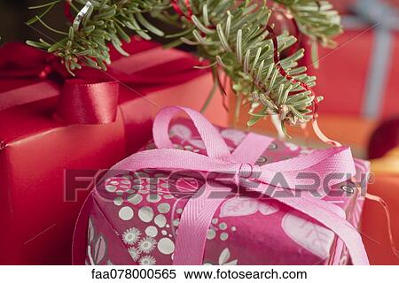 Stock Photography - Festively wrapped Christmas gifts, close-up. Fotosearch