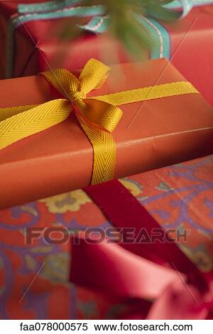 Stock Photography - Festively wrapped Christmas gifts, close-up. Fotosearch