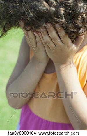 Girl covering face with hands View Large Photo Image Picture - Girl covering face with hands. Fotosearch
