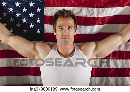 Stock Photo - Male athlete in front of American flag. Fotosearch