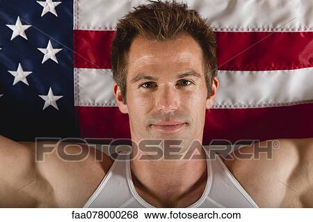 Male athlete in front of American flag, portrait View Large Photo Image Stock Photo - Male athlete in front of American flag, portrait. Fotosearch