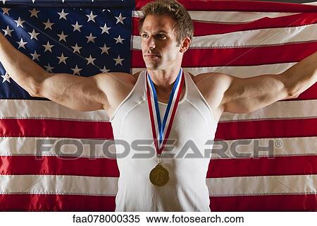 Male medalist in front of American flag View Large Photo Image Stock Photography - Male medalist in front of American flag. Fotosearch