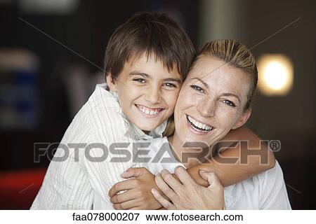 Mother and son embracing, portrait View Large Photo Image Stock Photo - Mother and son embracing, portrait. Fotosearch