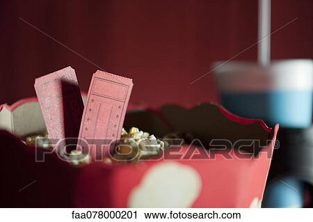 Stock Image - Movie tickets and popcorn. Fotosearch