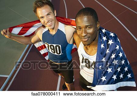 Running teammates holding up American flag after race View Large Photo Image Stock Image - Running teammates holding up American flag after race. Fotosearch