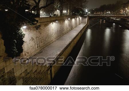 Stock Photo - Seine river by night, Paris, France. Fotosearch