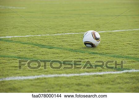 Soccer ball left on soccer field View Large Photo Image Picture - Soccer ball left on soccer field. Fotosearch