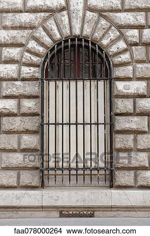 Picture - Window with metal grate. Fotosearch