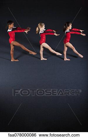 Young girl gymnasts practicing View Large Photo Image Stock Photograph - Young girl gymnasts practicing. Fotosearch