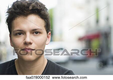 Young man smiling, portrait View Large Photo Image Stock Image - Young man smiling, portrait. Fotosearch