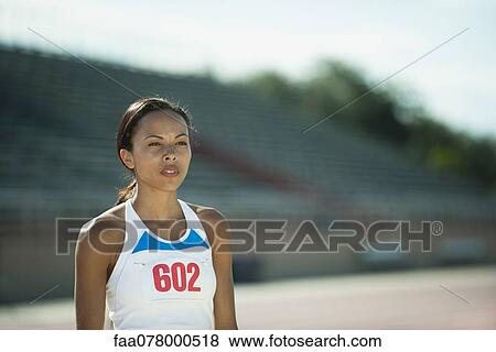 Stock Photo - Young woman runner, portrait. Fotosearch